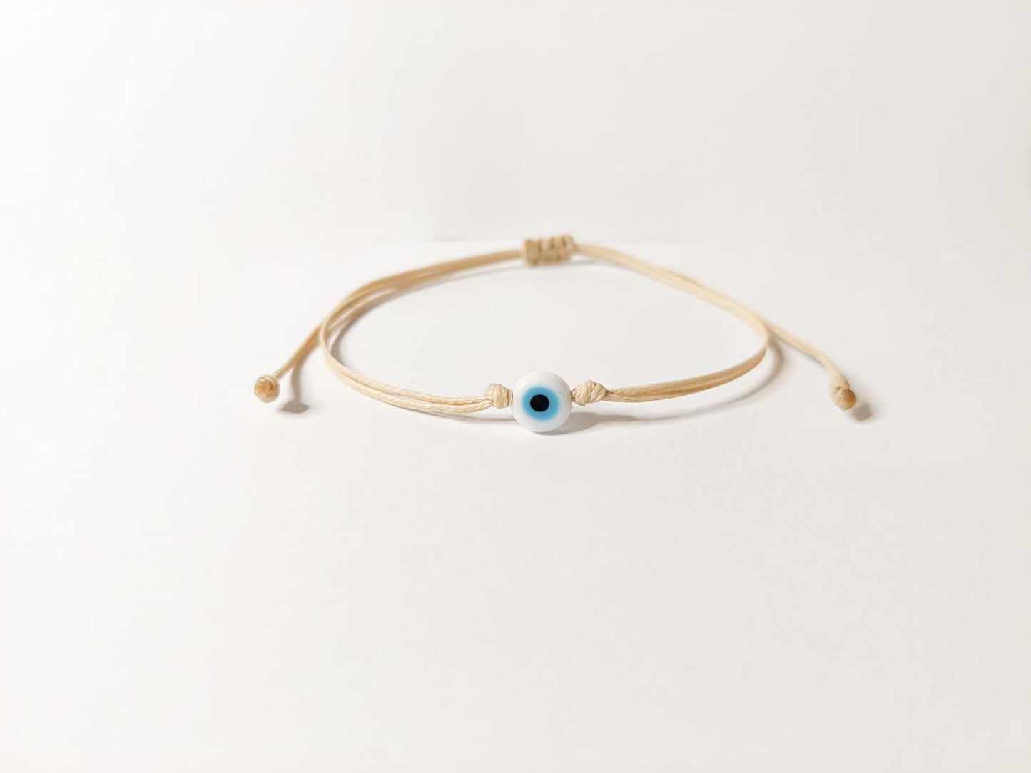 BEIGE THREAD WITH EYE BRACELET