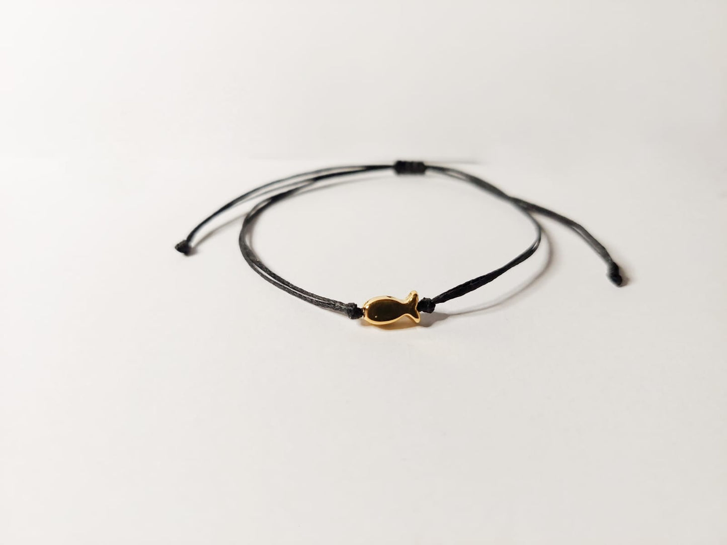 BLACK THREAD WITH GOLD FISH BRACELET