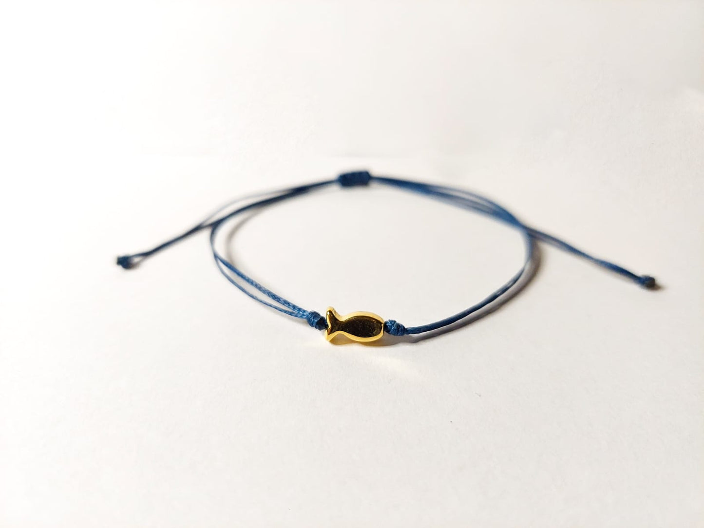 NAVY BLUE THREAD WITH GOLD FISH BRACELET