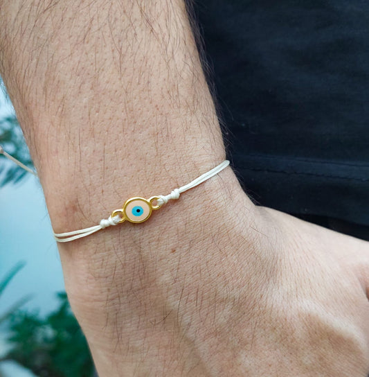 BEIGE THREAD WITH PEACH-GOLD EVIL EYE BRACELET