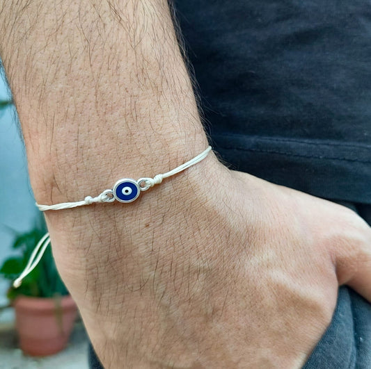 BEIGE THREAD WITH BLUE-SILVER EVIL EYE BRACELET