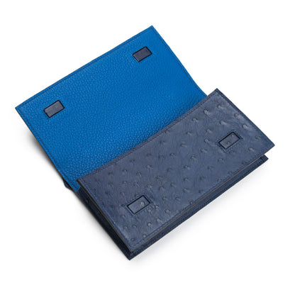blue ostrich with sky blue clutch bag