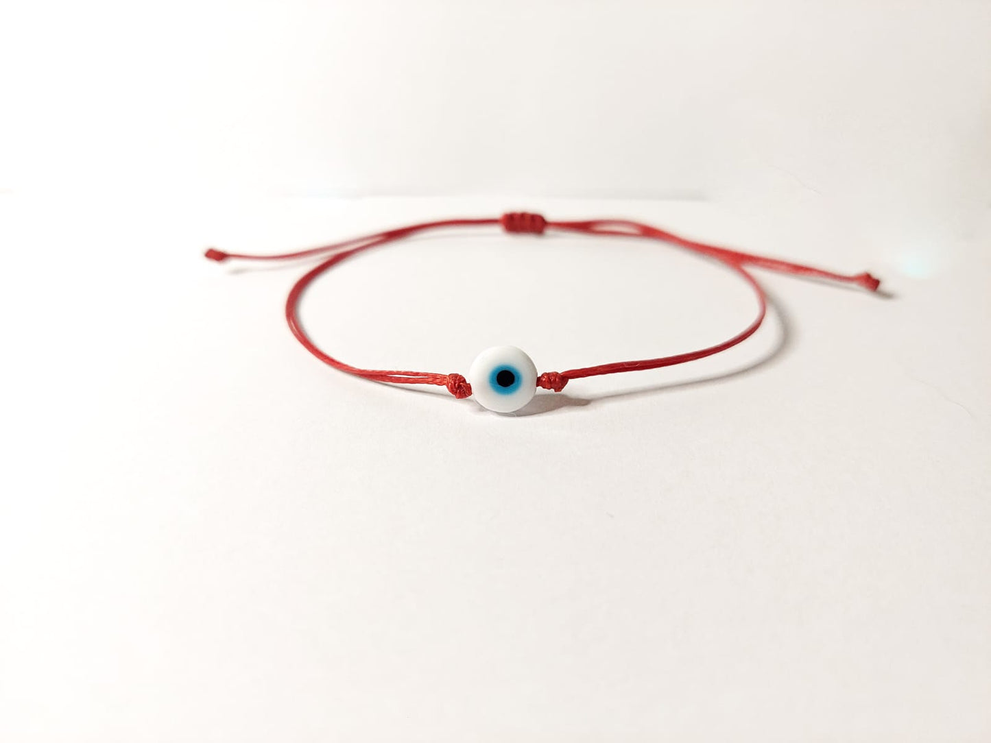 RED THREAD WITH WHITE EVIL EYE BRACELET