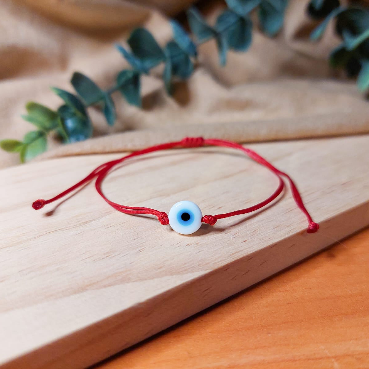 RED THREAD WITH WHITE EVIL EYE BRACELET