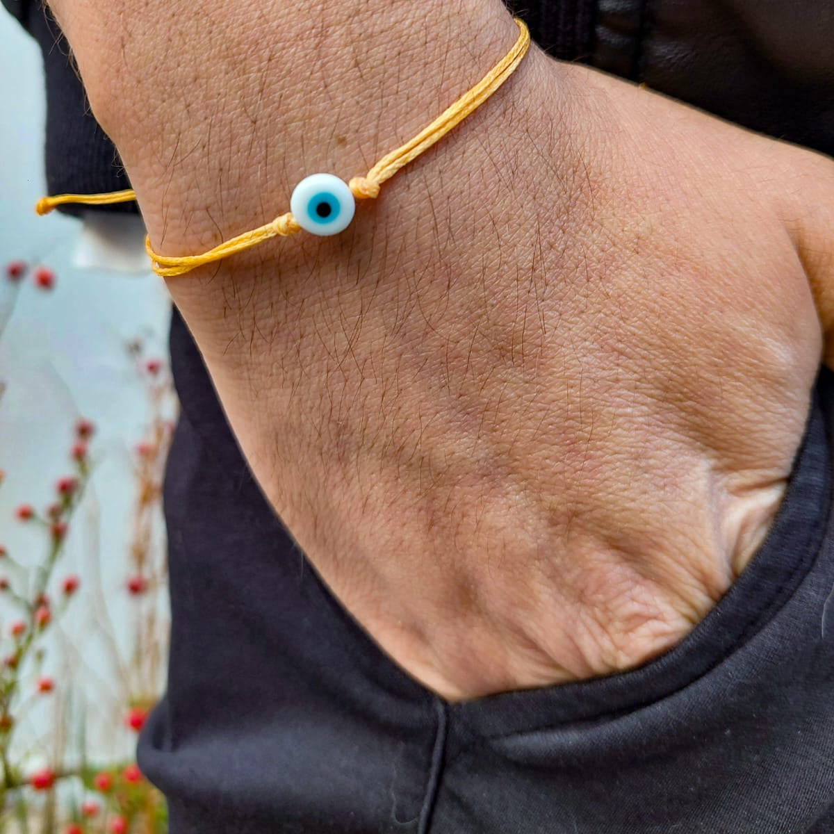 ORANGE THREAD WITH WHITE EVIL EYE BRACELET