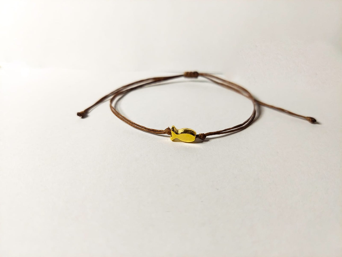 BROWN THREAD WITH GOLD FISH BRACELET