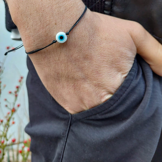 BLACK THREAD WITH WHITE EVIL EYE BRACELET