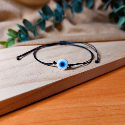 BLACK THREAD WITH WHITE EVIL EYE BRACELET