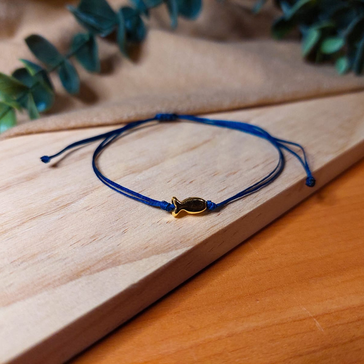 NAVY BLUE THREAD WITH GOLD FISH BRACELET