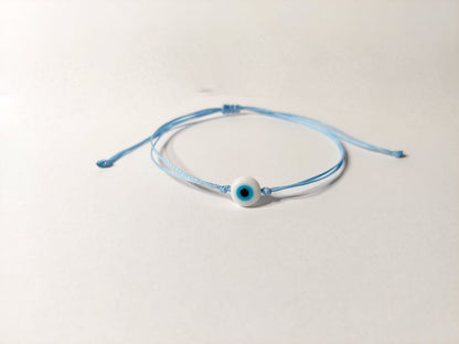 BABY BLUE THREAD WITH WHITE EVIL EYE BRACELET
