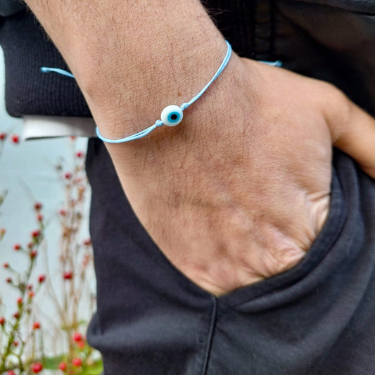 BABY BLUE THREAD WITH WHITE EVIL EYE BRACELET