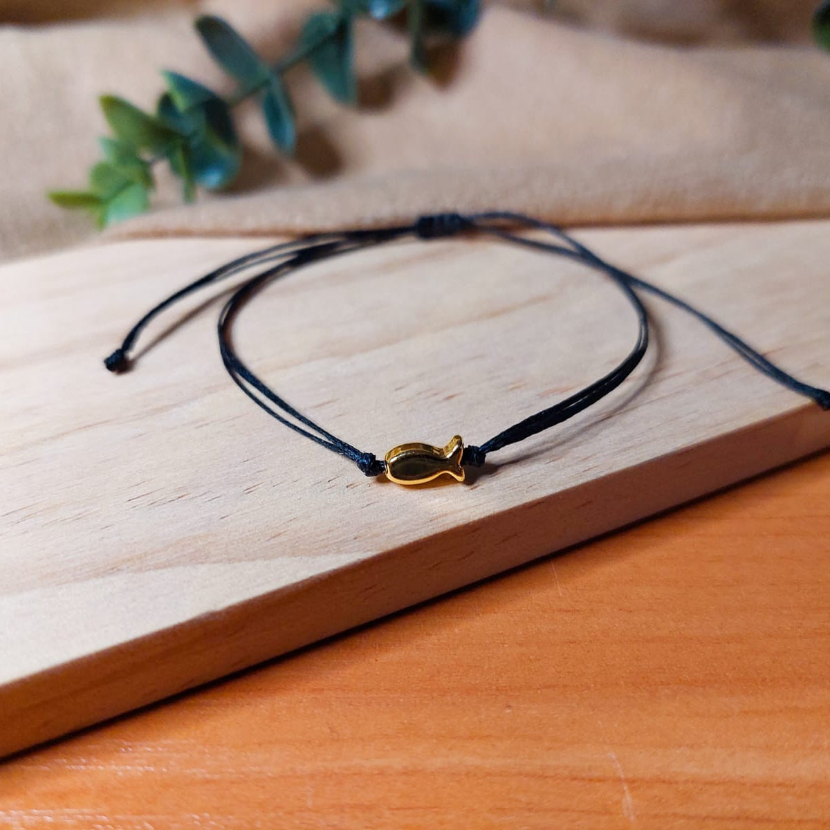 BLACK THREAD WITH GOLD FISH BRACELET