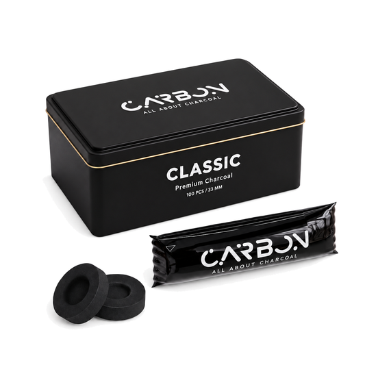 Carbon CLASSIC charcoal tin, sleeve and charcoal pieces on a pure white background