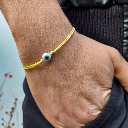 YELLOW  THREAD WITH EYE BRACELET
