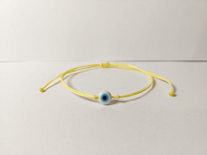 YELLOW  THREAD WITH EYE BRACELET